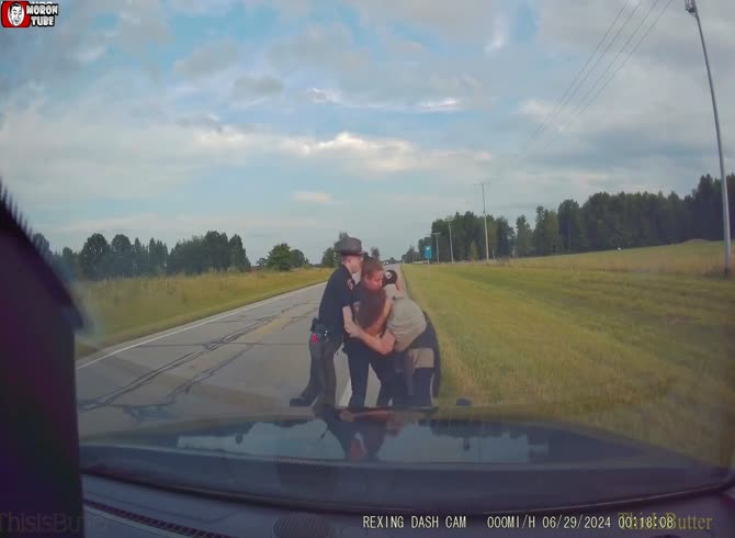 Video :A wanted woman is shown striking a Georgetown police officer in the face on an in-car camera